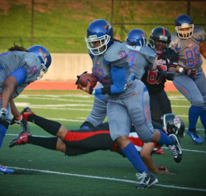 RB Alexandria Barton (#32) finds running room after a block by Janiah Ford (#69/OT).Image used with permission.